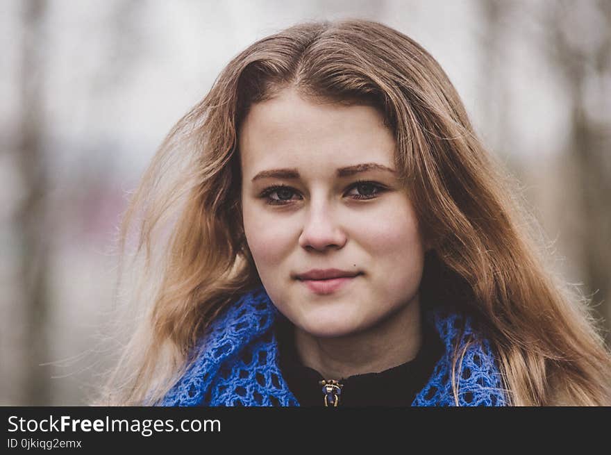 Selective Focus Photo of Woman Wearing Knitted Blue and Black Top