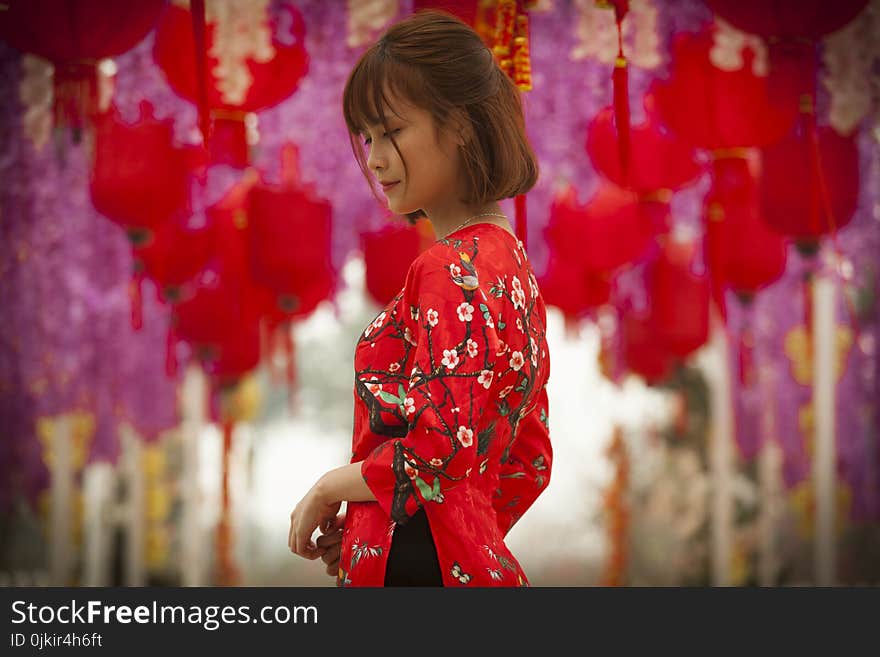 Woman in Red and White Floral Cheonsam Smiling