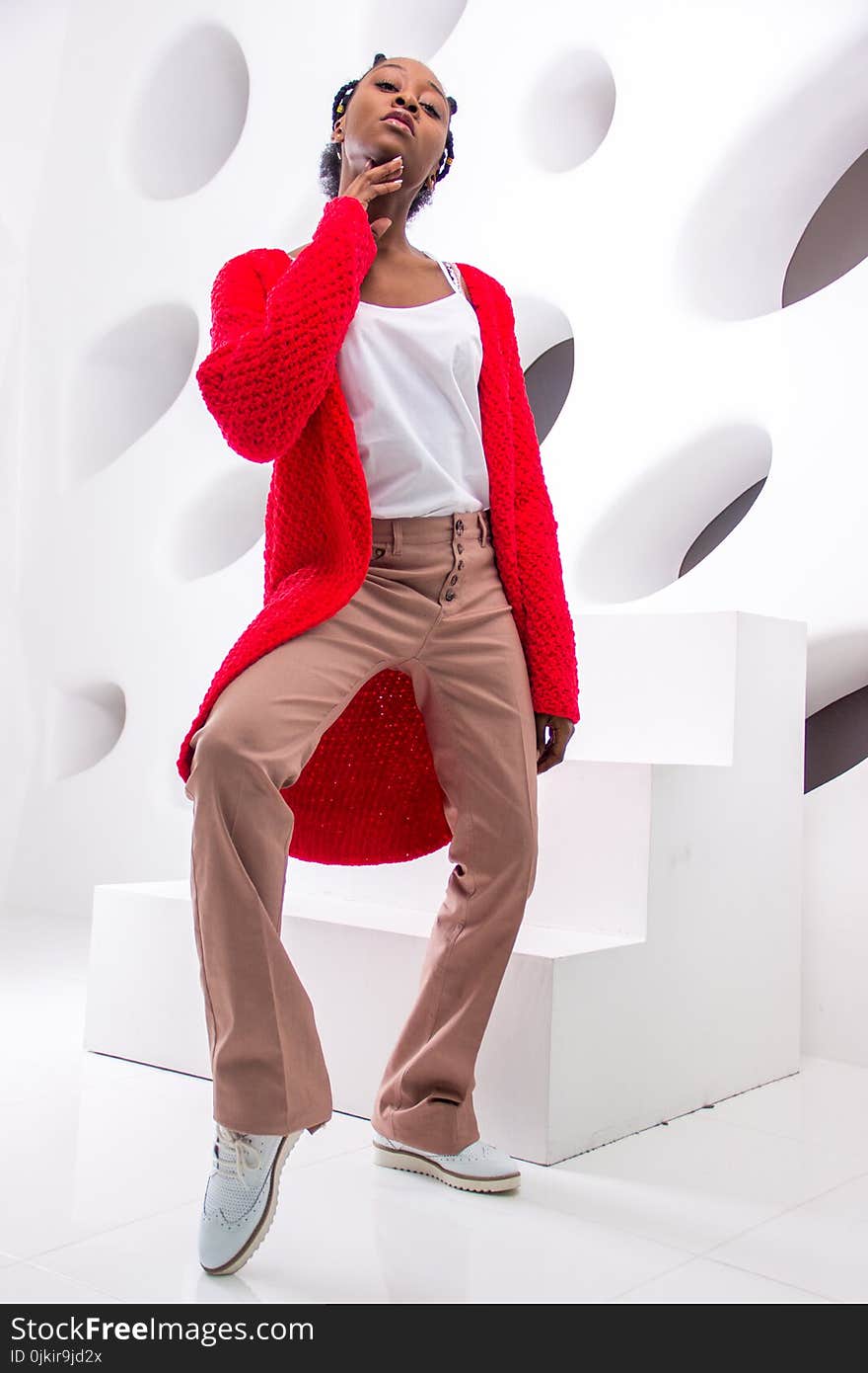 Woman Wearing Shirt, Red Cardigan, Beige Dress Pants