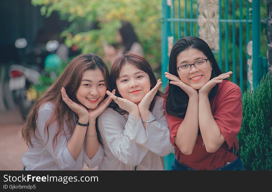 Three Girl&#x27;s Wearing White and Red Dress Shirts