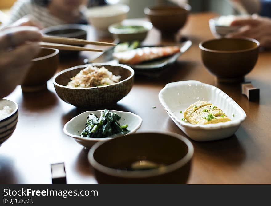 Shallow Focus Photography of Dinnerwares on Top of Brown Wooden Table