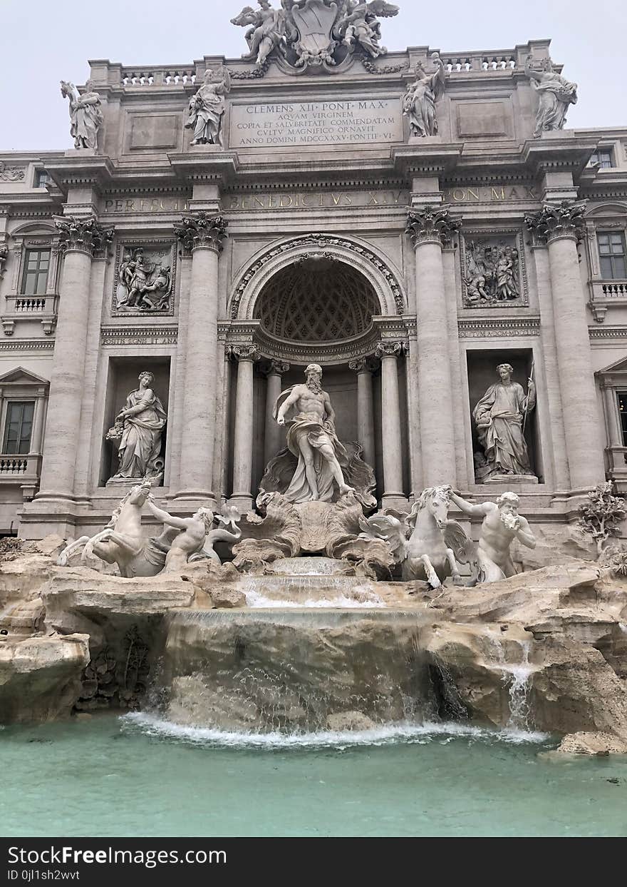 Concrete Structure With Group of People Statues