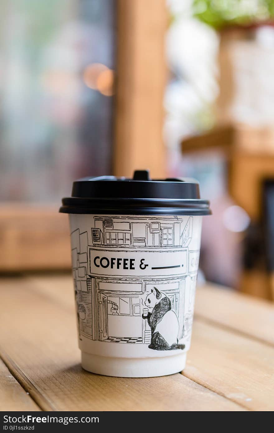 Panda Printed Paper Coffee Cup on Table