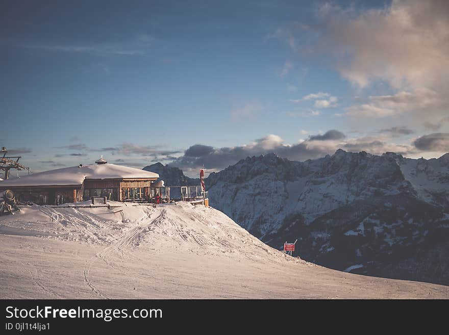 Brown and White Cottage on Mountain