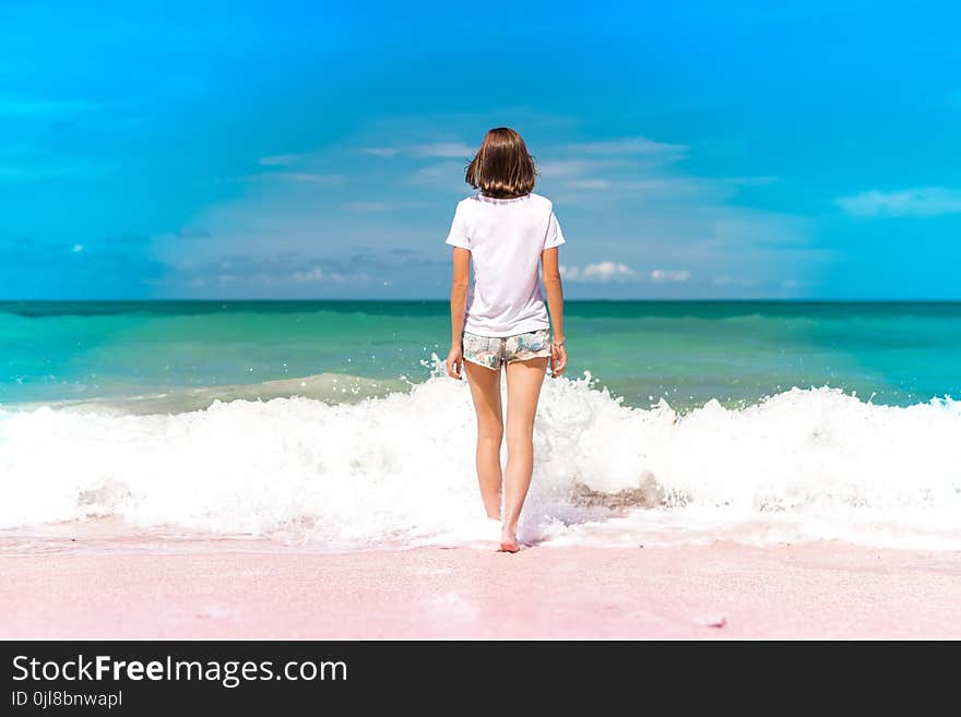 Woman Standing on Seashore