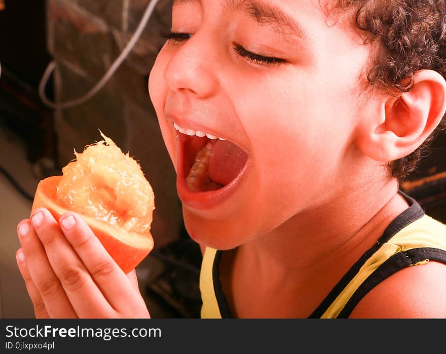 Boy enjoy with eat Fresh Mango. Boy enjoy with eat Fresh Mango