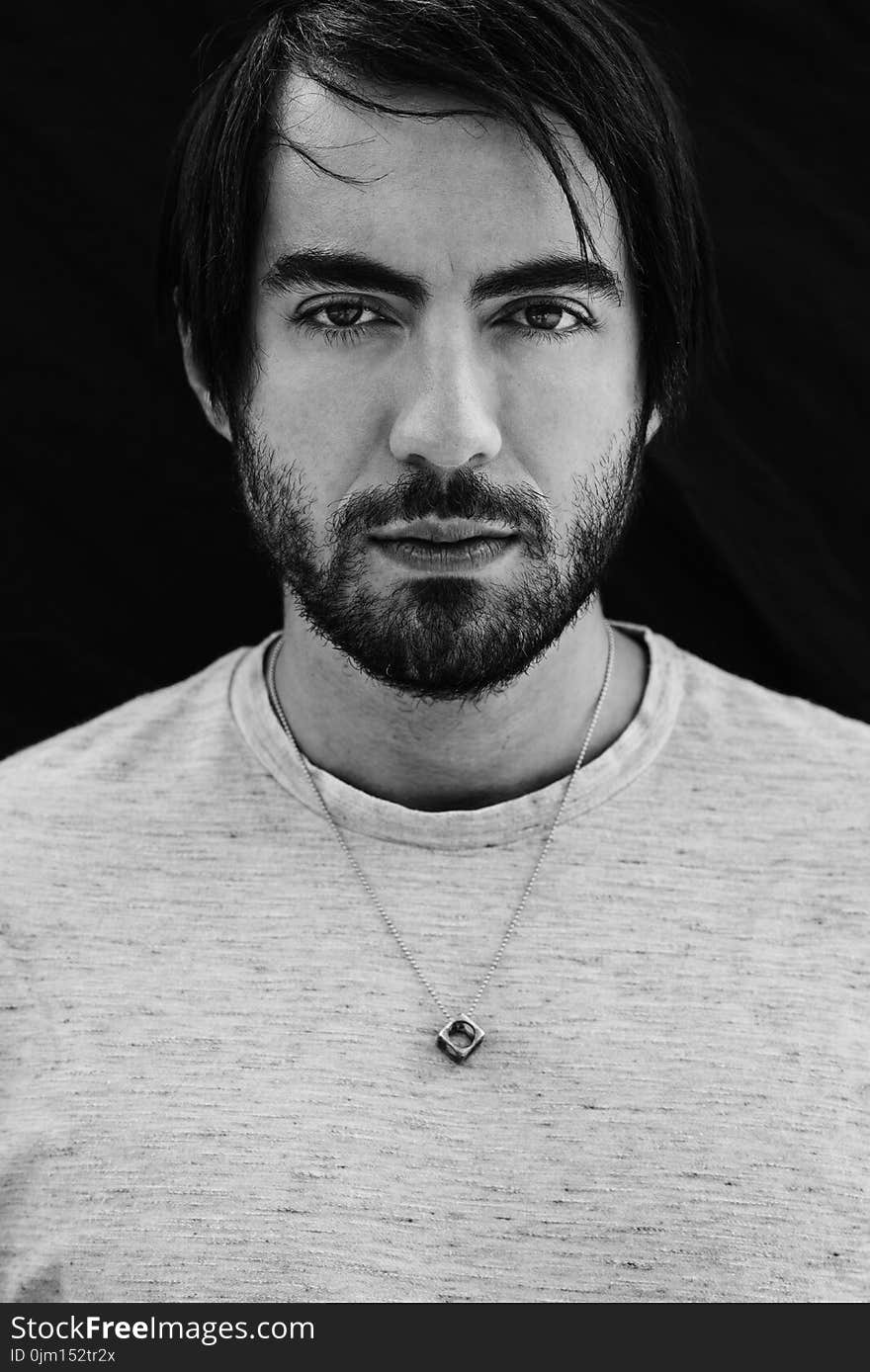 Grayscale Photo of Man Wearing Gray Crew-neck Shirt