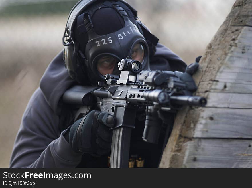 Person Holding Airsoft Gun in Shallow Focus Lens