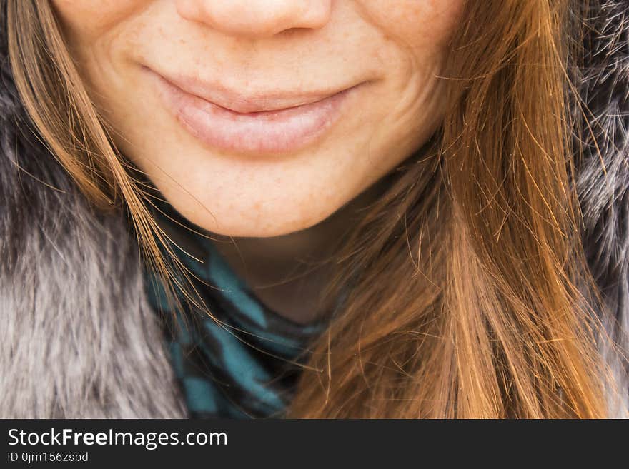 Smiling Woman Wearing Gray Fur Top