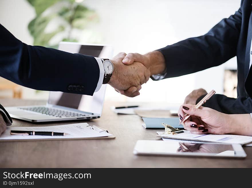 Two Person in Formal Attire Doing Shakehands