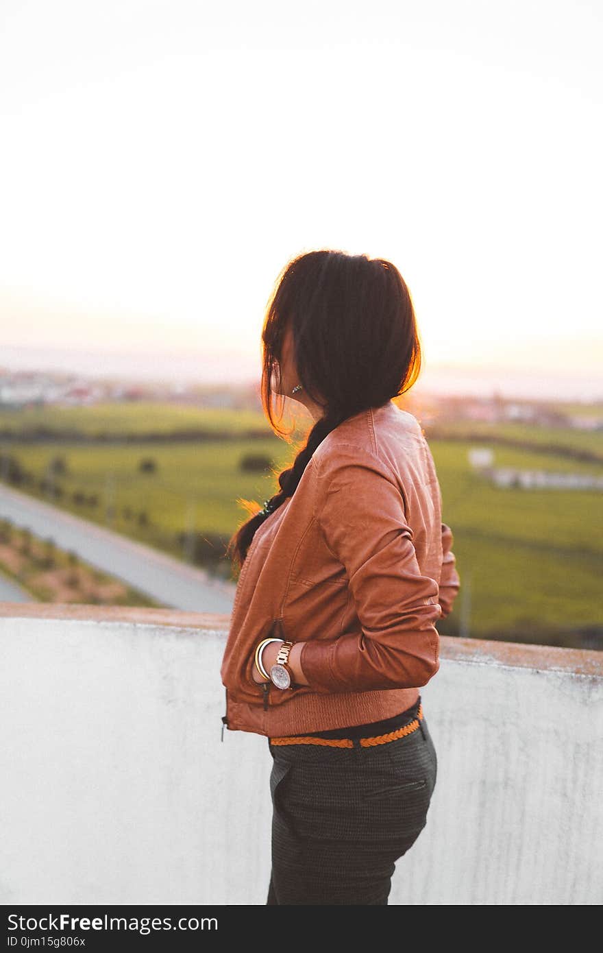 Side View of Woman Wearing Brown Leather Jacket