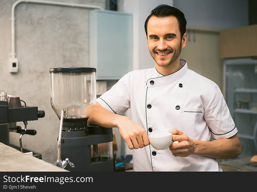 Chef Holding White Tea Cup