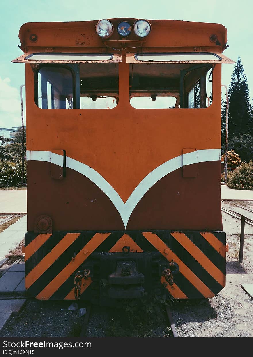 Orange, White, and Brown Train