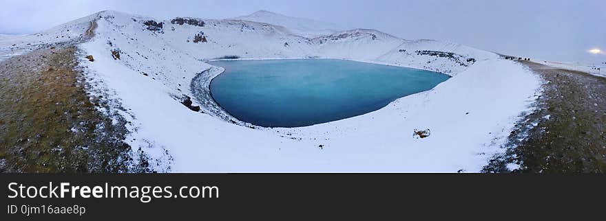 Blue Lake in the Middle of Snowfield