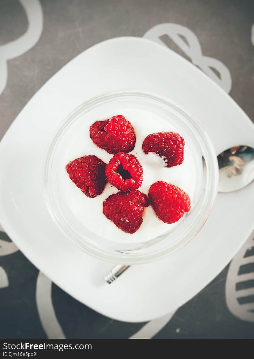 White Cream and Red Berries on Plate