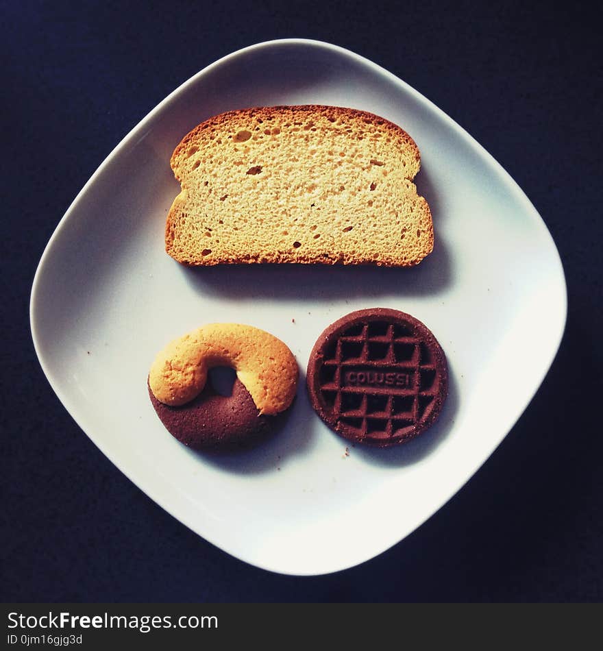 Toasted Bread, Donut, and Chocolate on Top of White Ceramic Plate