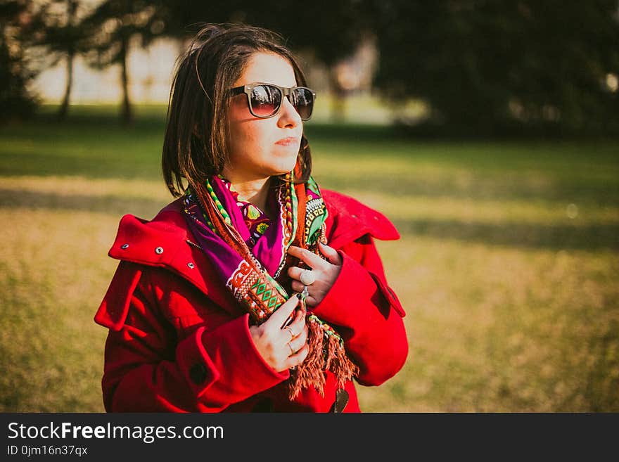 Woman In Red Coat With Black Sunglasses