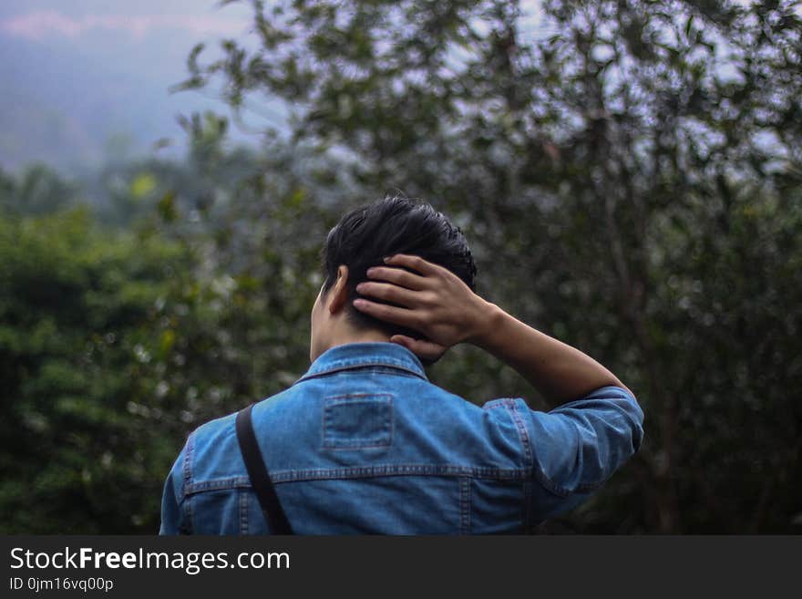 Person in Blue Denim Jacket