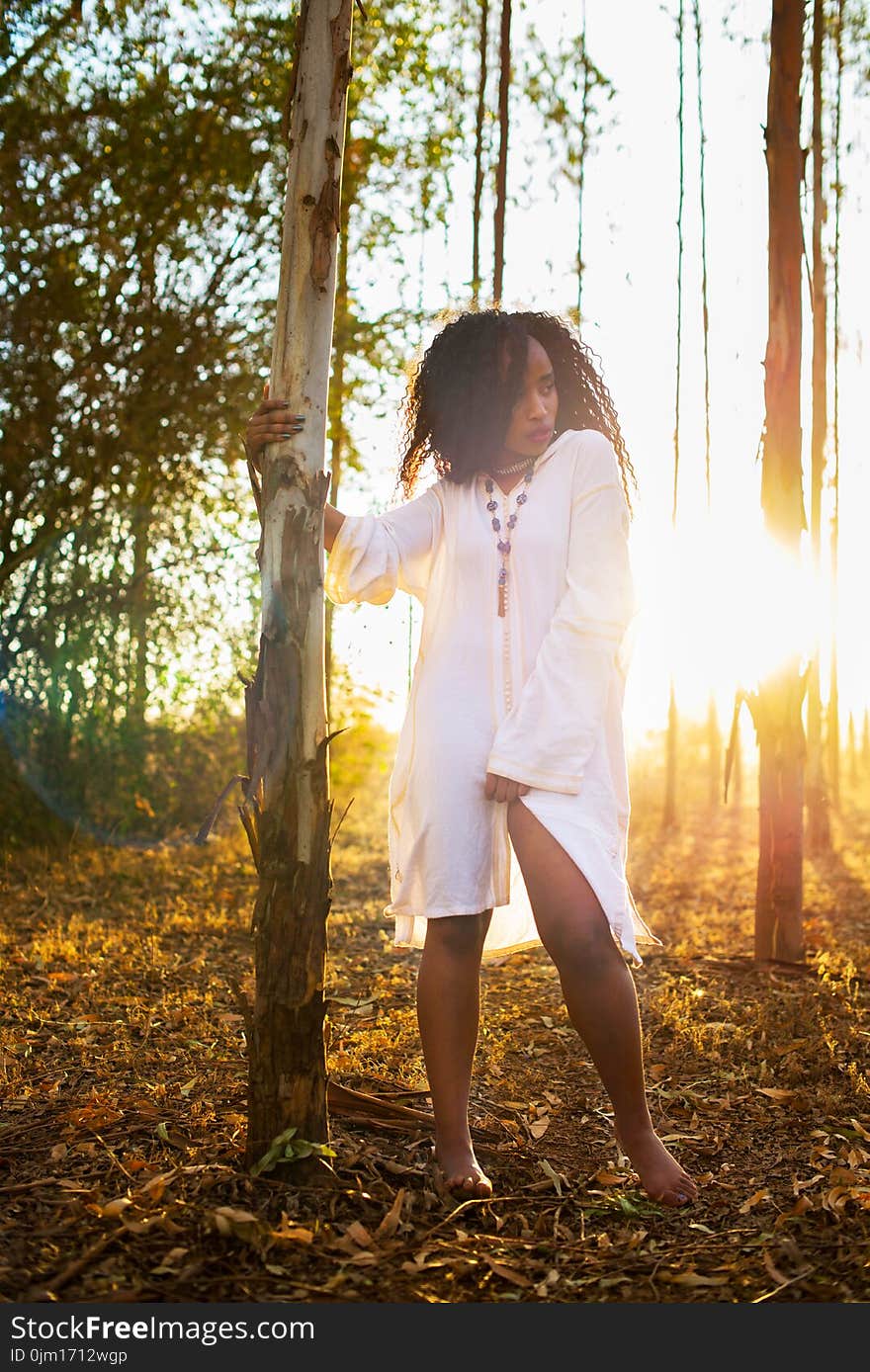 Woman Wearing Long-sleeved Shirt Standing Beside Tree