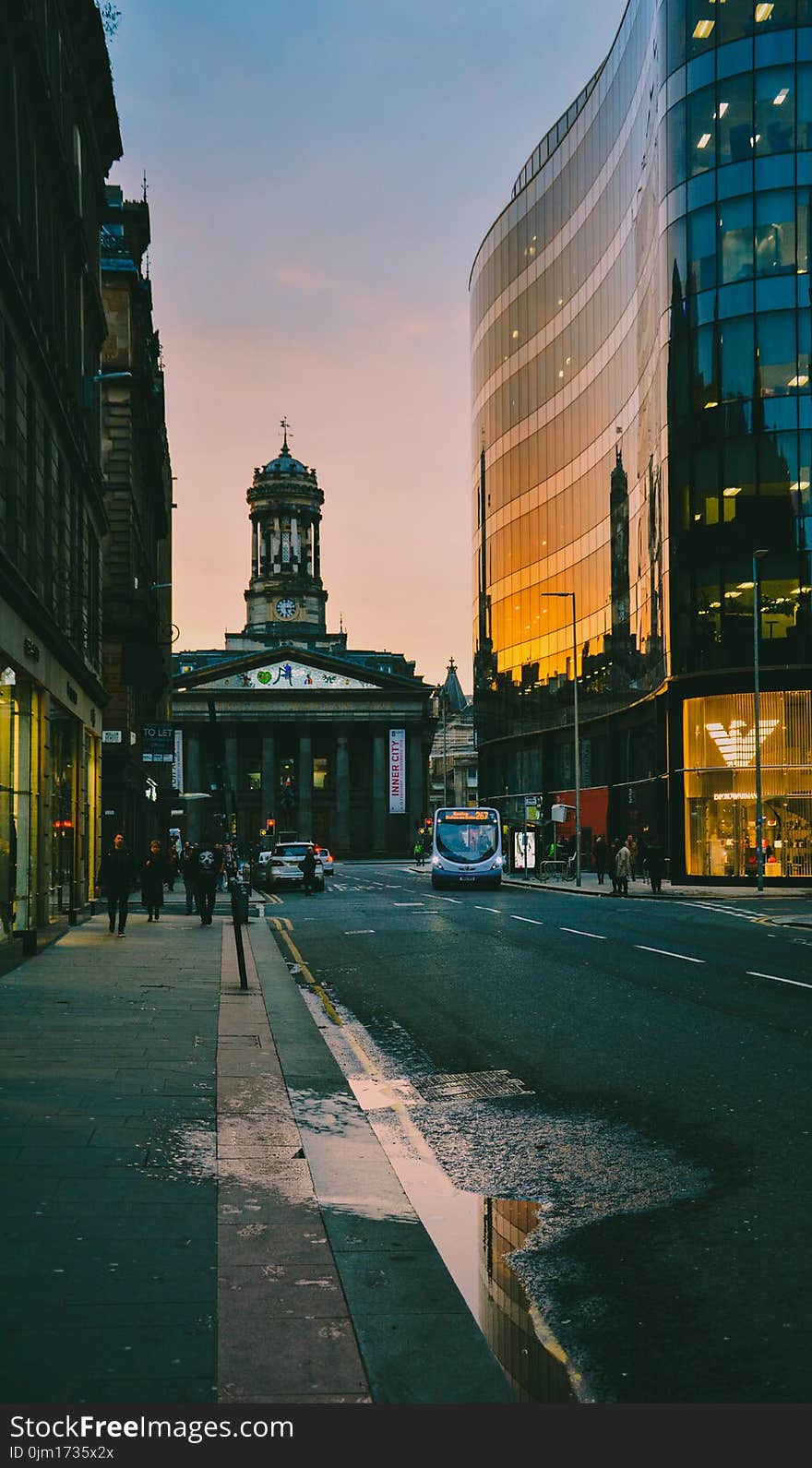 People Walking at Sidewalk during Sunset