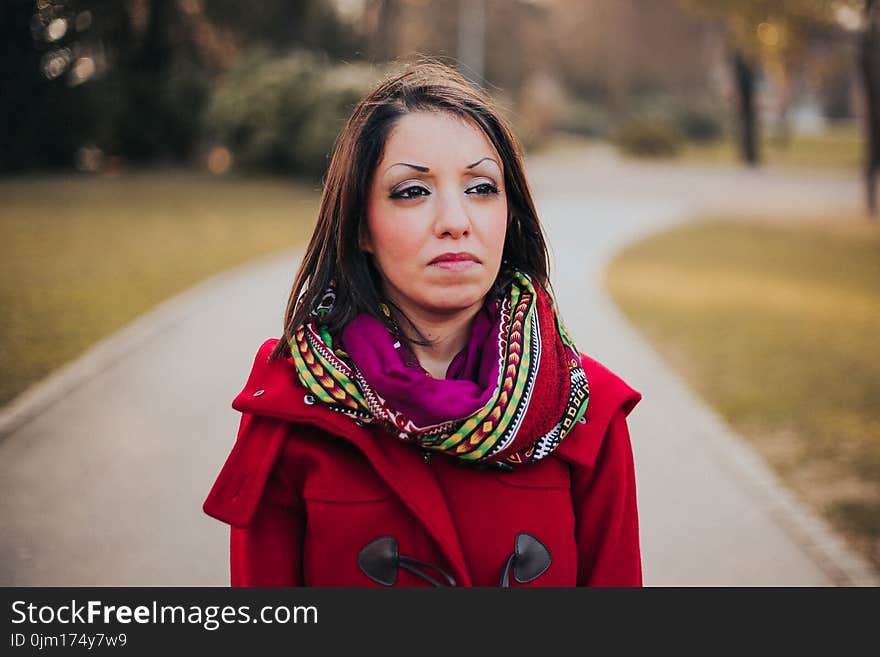 Woman Wearing Red Coat And Scarf