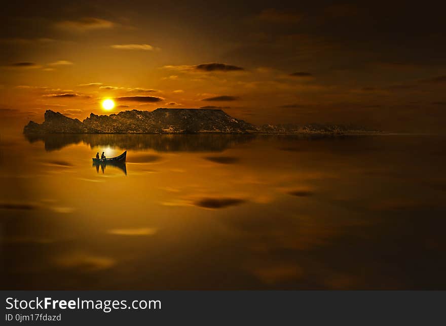 Twp People Riding Boat in Sunset Photo