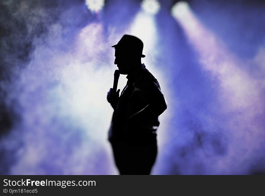 Man Holding Microphone Silhouette