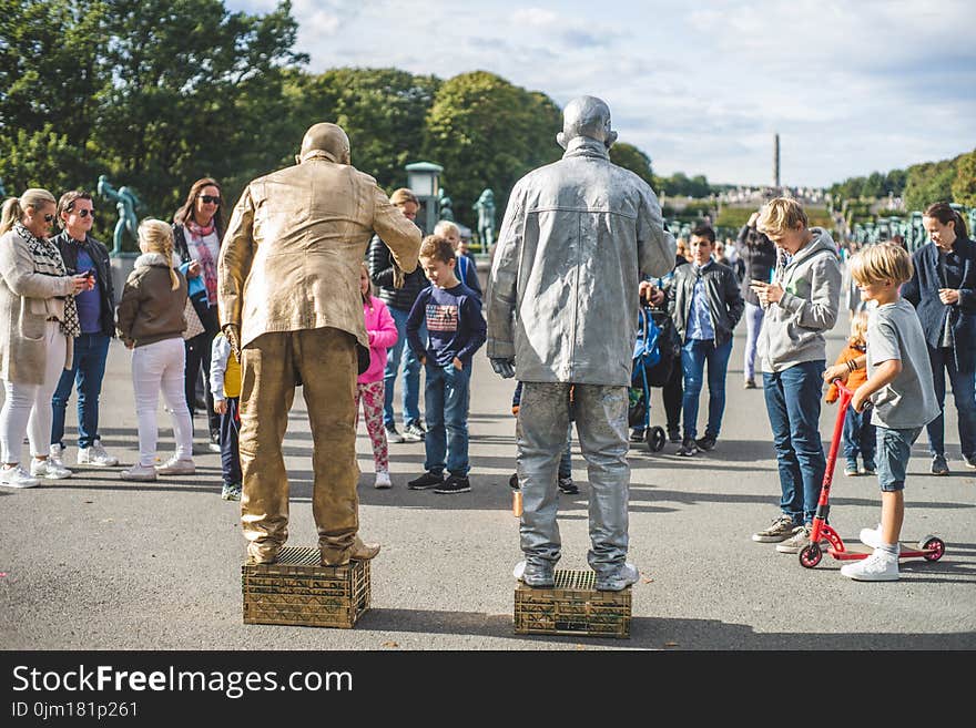 Two Gray and Brown Statues