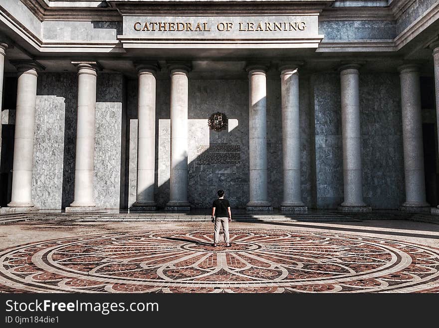 Photo of Person Standing in Front of Cathedral of Learning