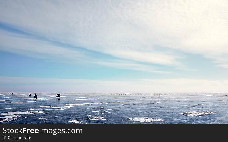 Photo of Five People on Ice Field