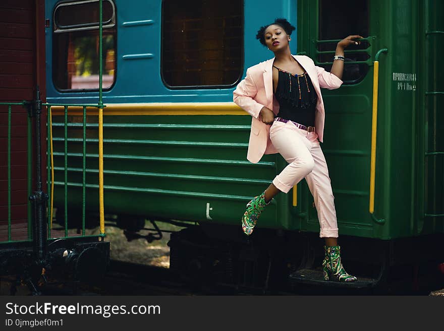 Woman Wearing Pink Blazer and Pants