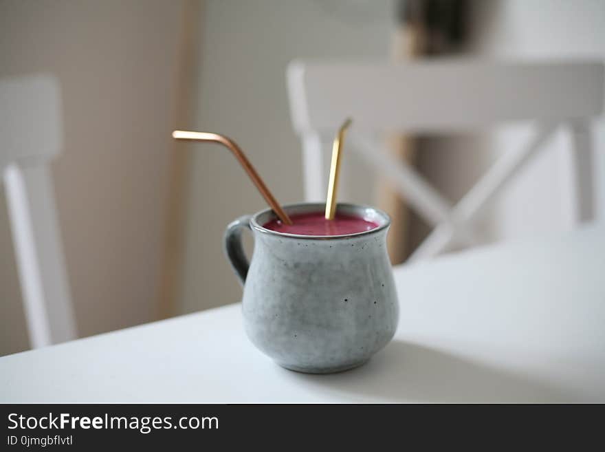 Gray Ceramic Mug With Pink Beverage