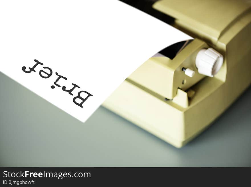 White Typewriter on Gray Table