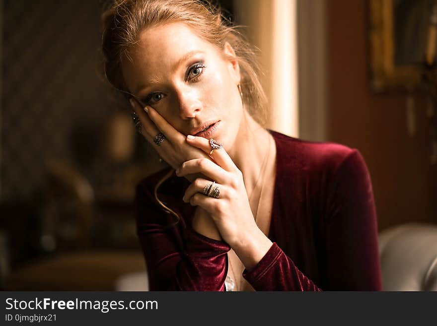 Woman With Red Long-sleeved Top