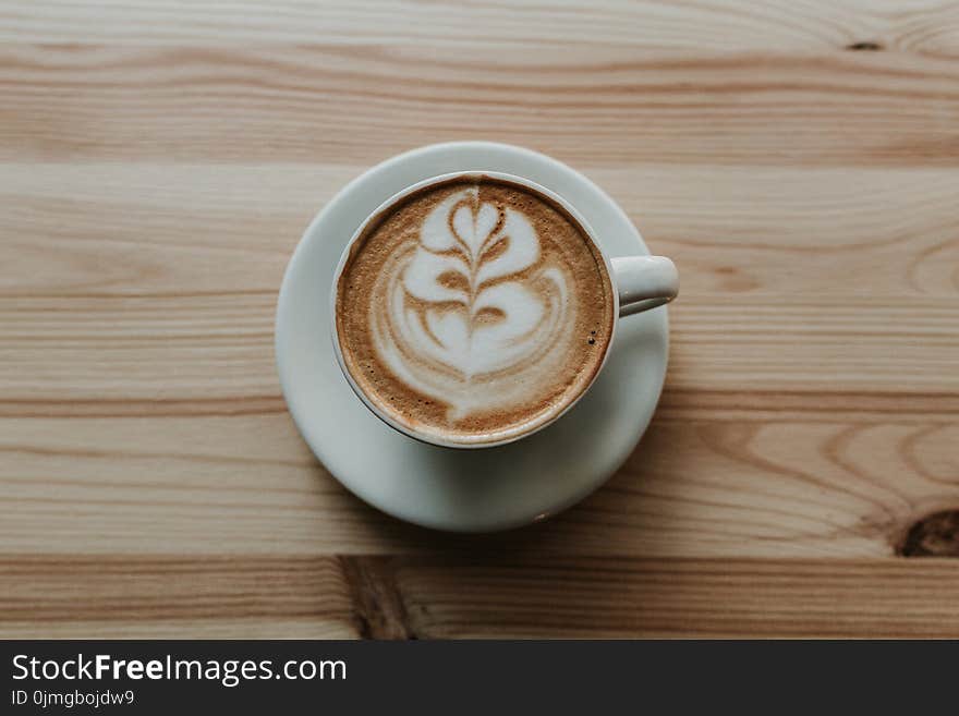 Coffee in White Ceramic Teacup on White Ceramic Suacer