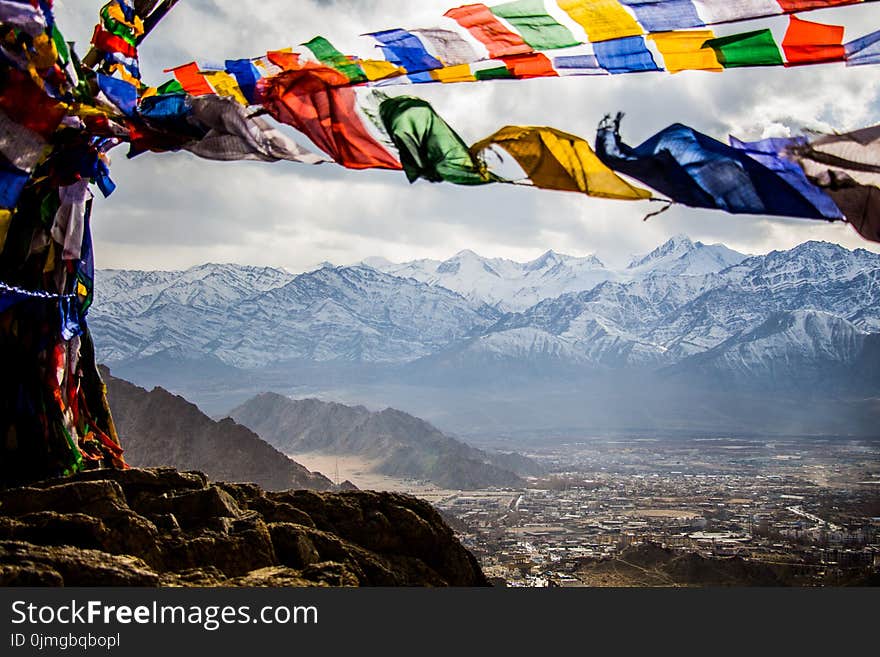 Assorted-color Banners on Mountain