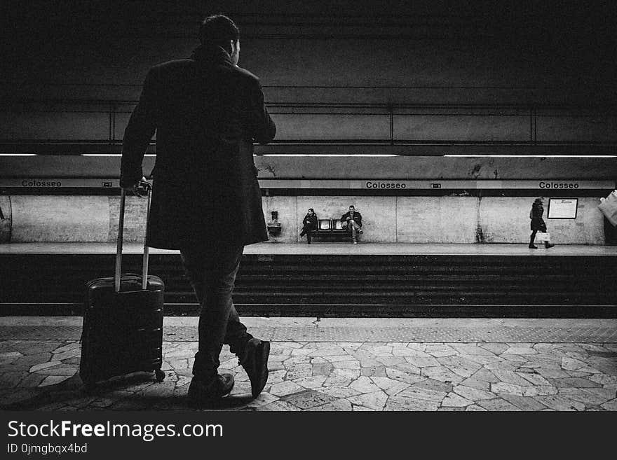 Man With Luggage Bag on Train Station