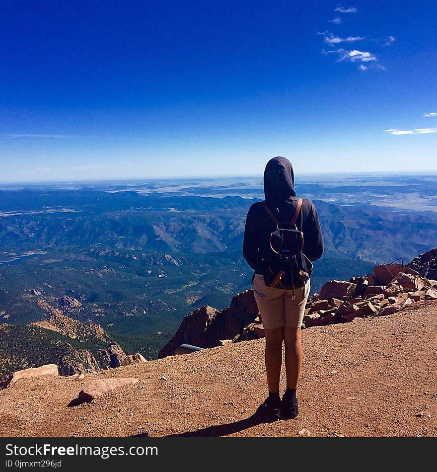 Person Wearing Black Hooded Jacket Staring on Landscape