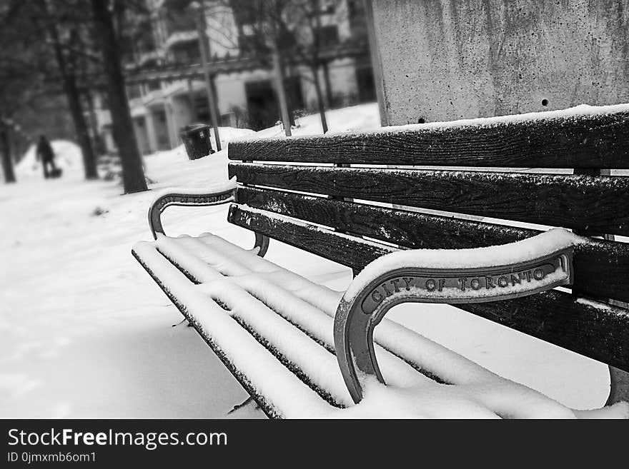 Monochrome Photography of Bench Covered with Snow