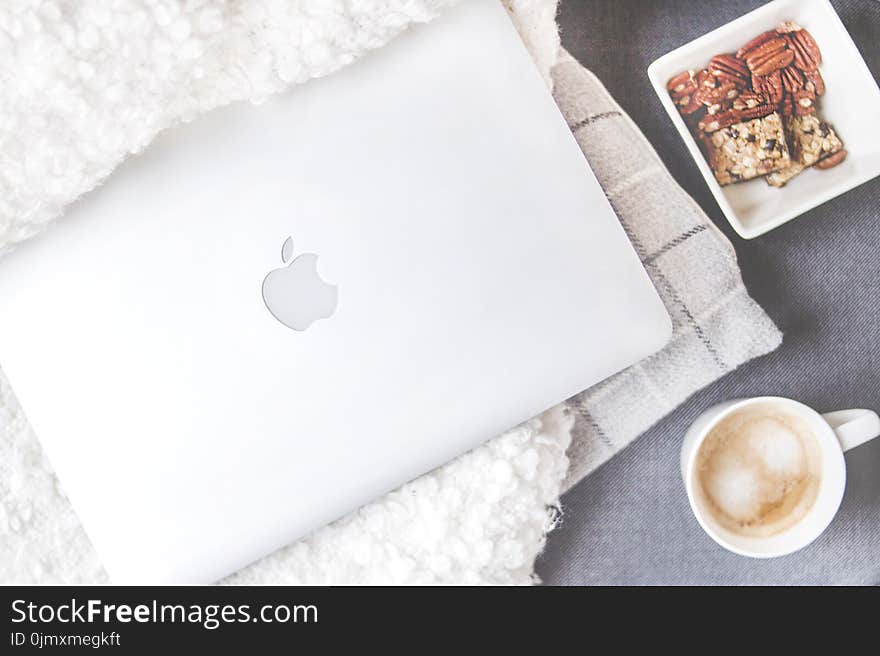 Flatlay Photography of Macbook and Snacks