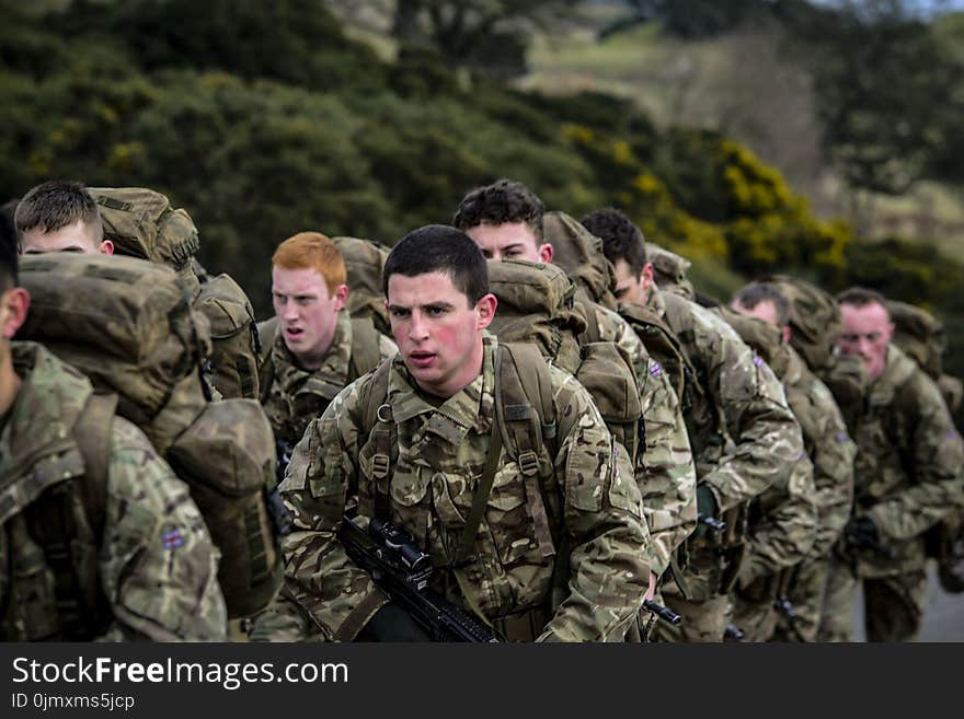 Armies in Camouflage Uniform Lining Up Closeup Photo