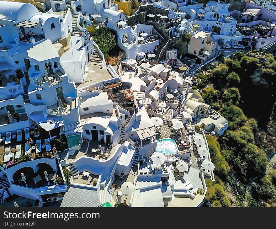 Aerial Photo of White Buildings Near Trees at Daytime