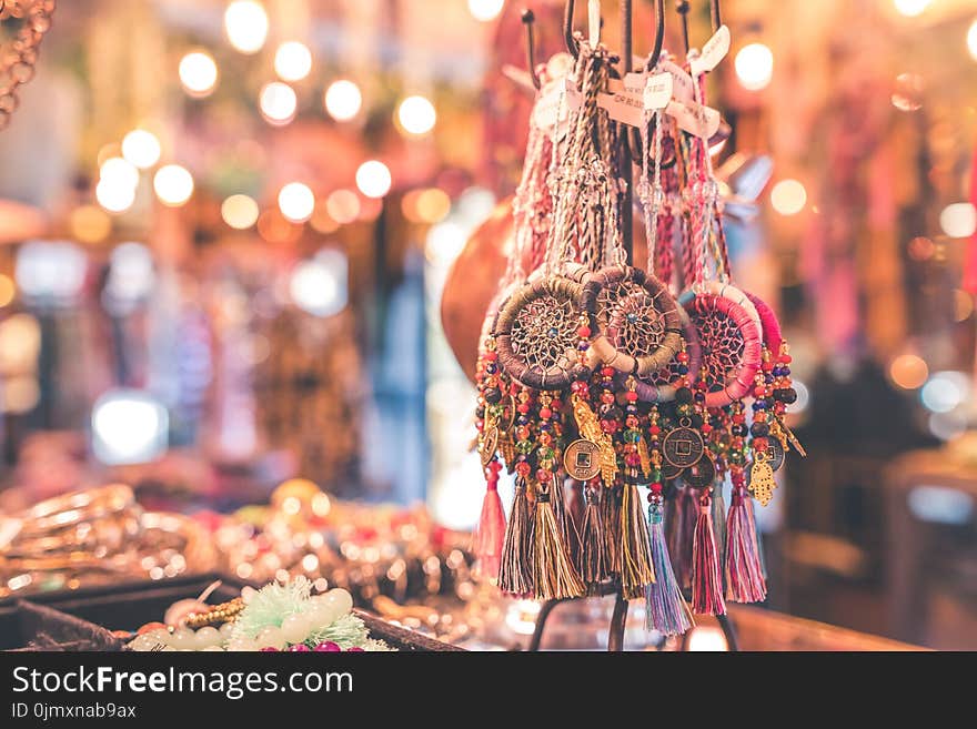 Person Showing Assorted Dream Catcher Keychain Lot in Tilt Shift Photography