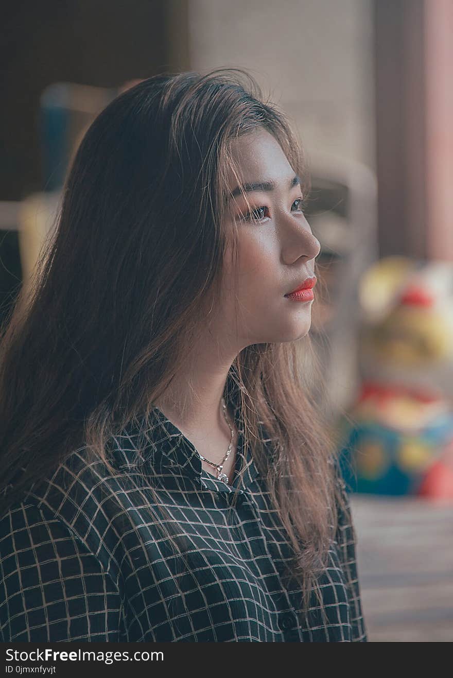 Woman Wearing White and Black Checkered Dress Top