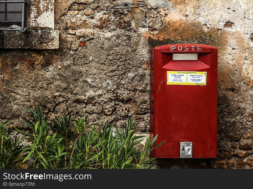 Red Mail Box Beside Green Grass