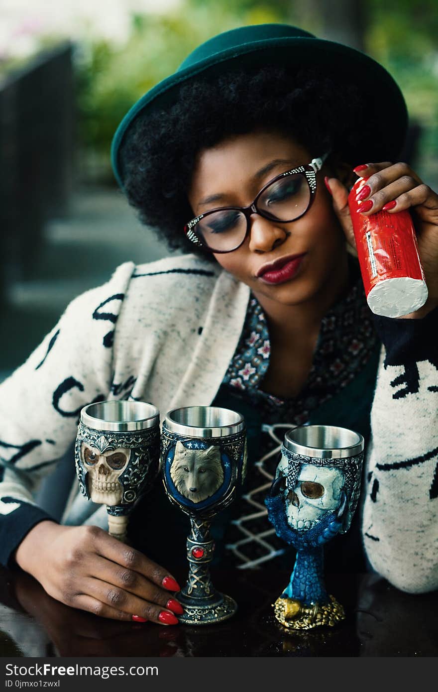 Woman Holding Three Chalices