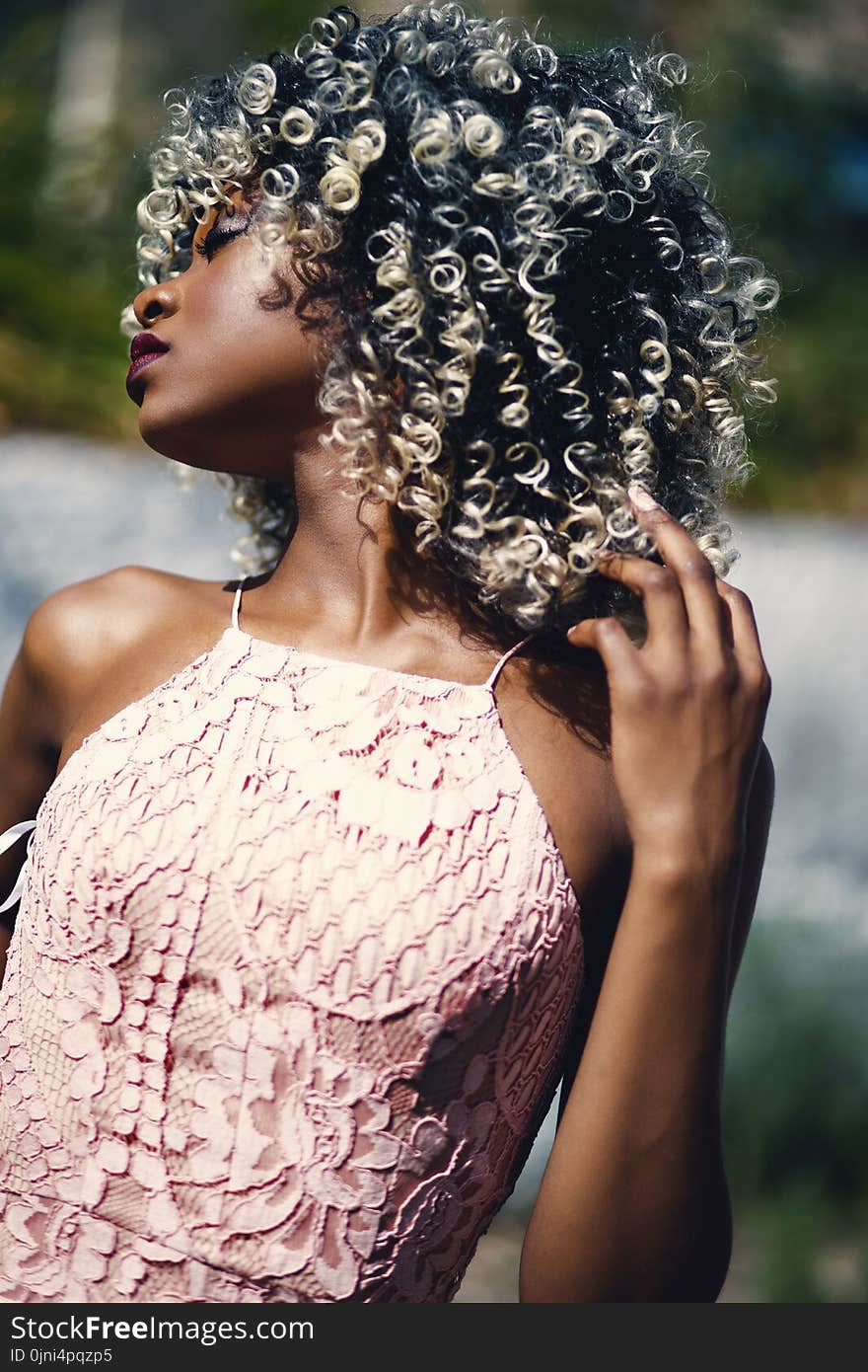 Woman Wearing 2-tone Beige Floral Spaghetti Strap Top