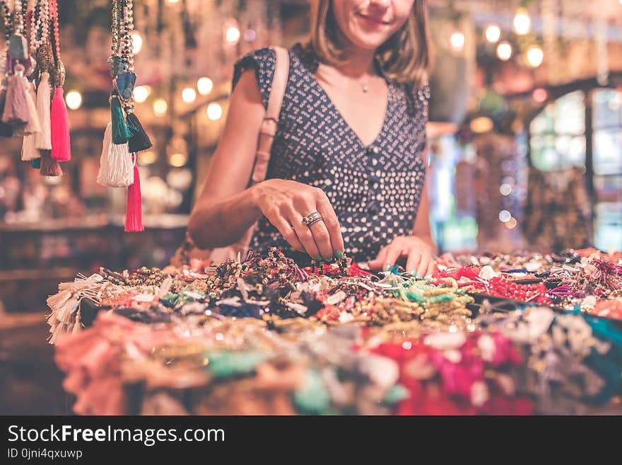 Woman Selecting Beaded Jewelry