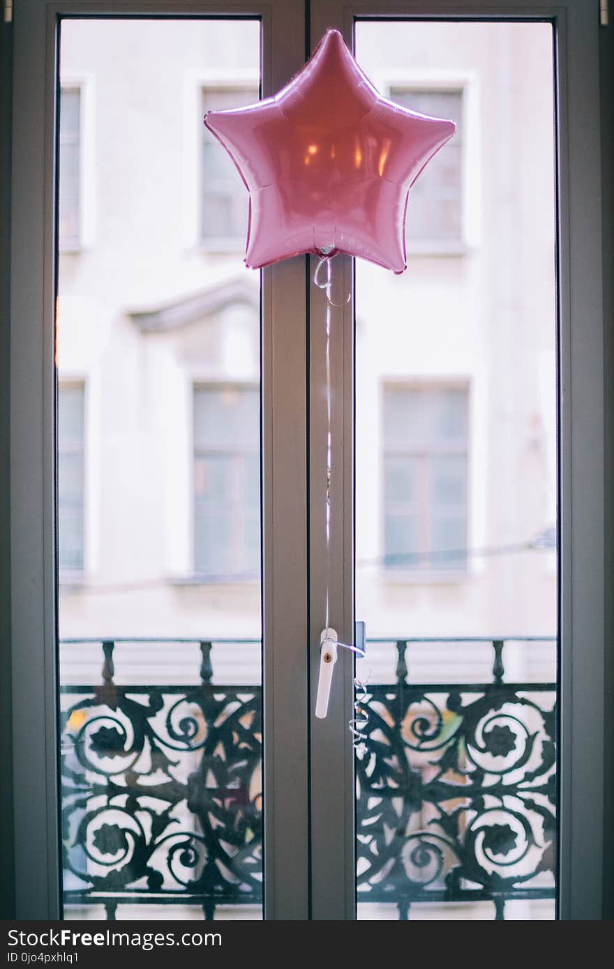 Photo of Pink Star Balloon Hang Beside Door