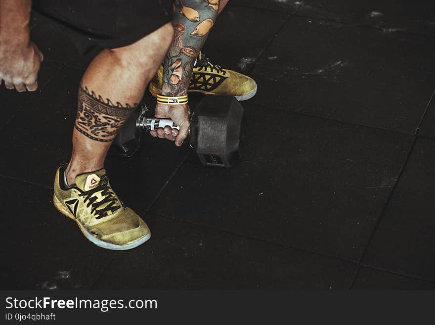 Man Wearing Yellow Running Shoes